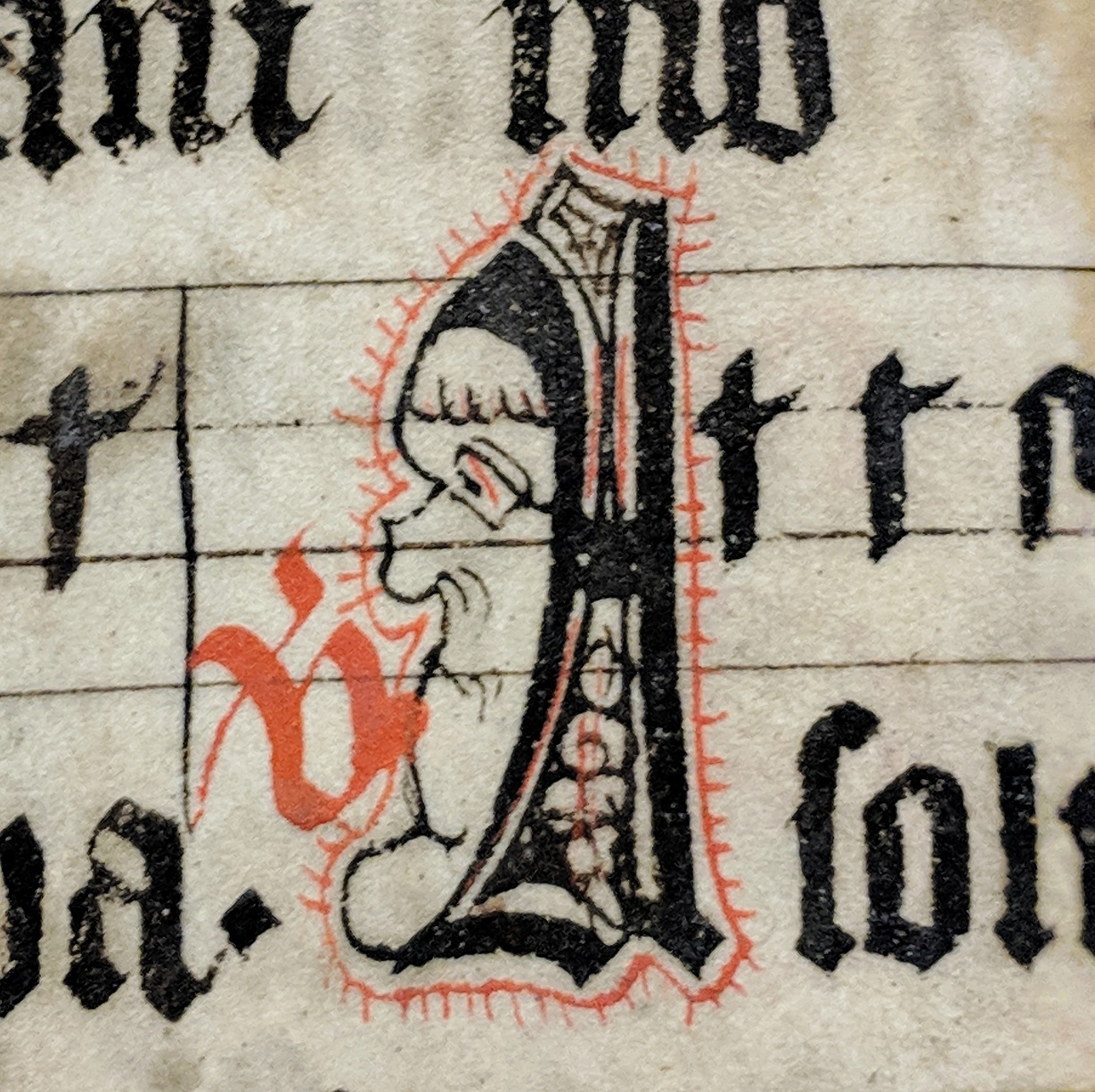 Tall and narrow man's face in Initial