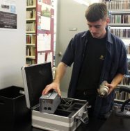 Rowan Grice working with AV equipment