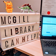 Laptop and light box on desk with the words "McGill Library can help!""