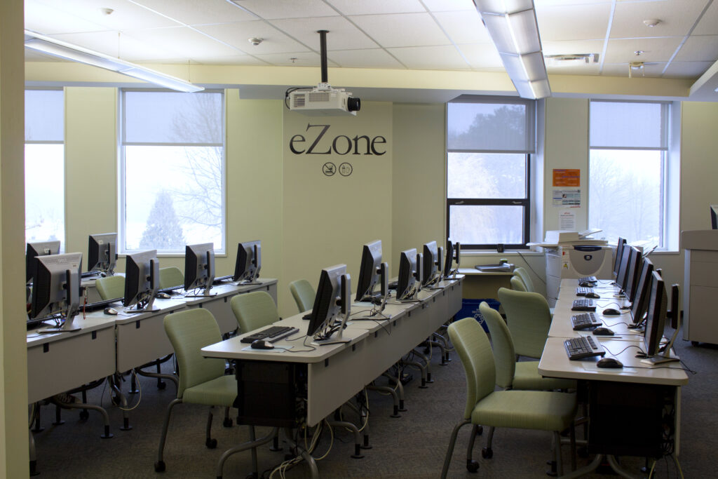 Mac Campus Library eZone filled with computer stations.