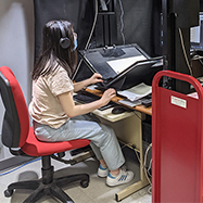 Helen Qin in the Digitization Lab