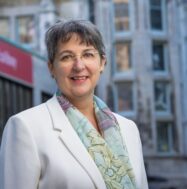 Dr. Guylaine Beaudry. Background: McLennan-Redpath Terrace.