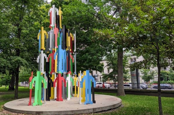 Colourful sculpture of human figures on McGill campus.
