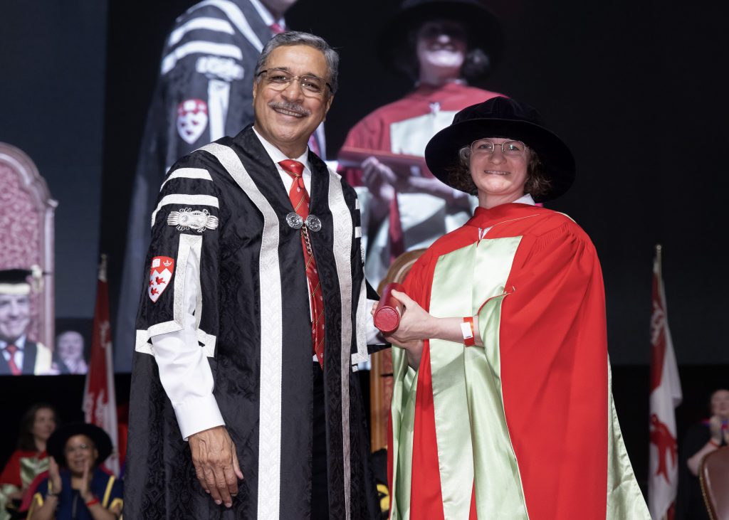 Mary Hague-Yearl receiving the award at convocation from Deep Saini, President & Vice-Chancellor. 