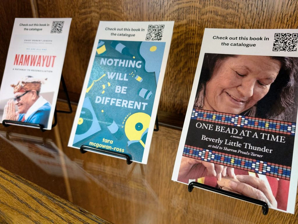 Indigenous Voices display featuring books Namwayut, Nothing will be Different, One Bead at a Time