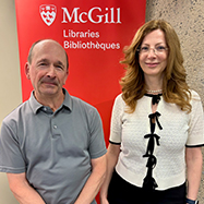 Steve Blaise (left) and Mila Bozic Erkic (right) smiling in front of a red McGill Libraries banner.